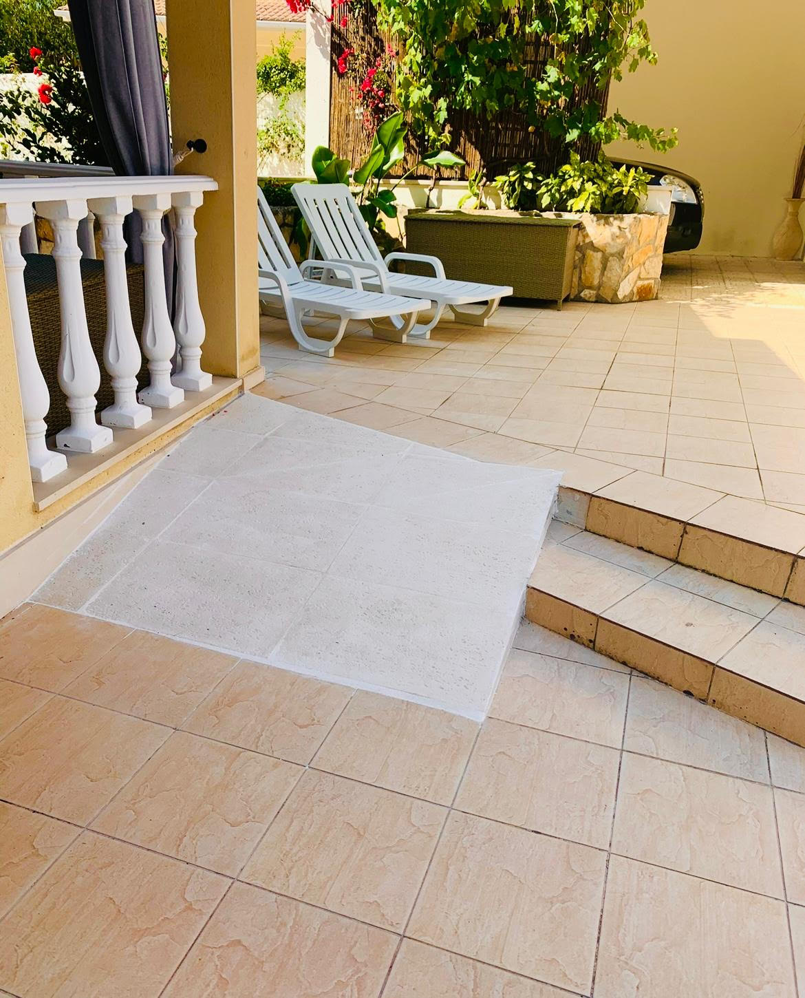 Ramp from the driveway up onto the front porch of the villa